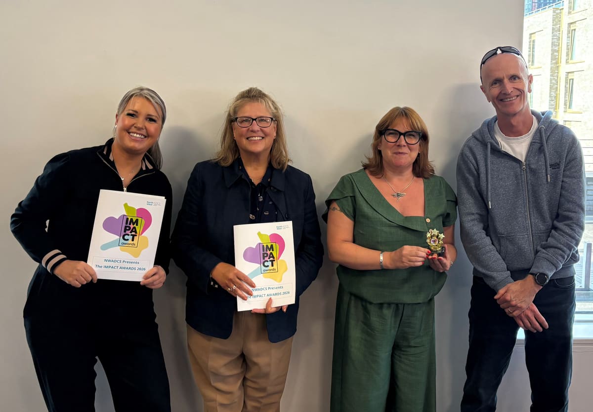 The Crewe transition pilot team with their IMPACT Awards trophy and certificates