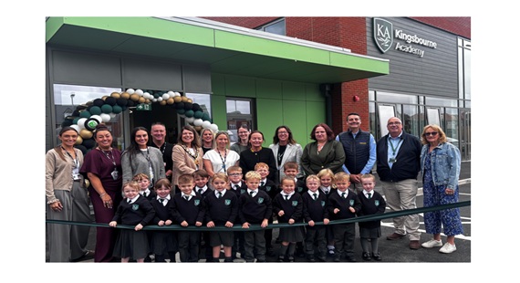 Children, school staff and guests outside the newly opened Kingsbourne Academy in Nantwich