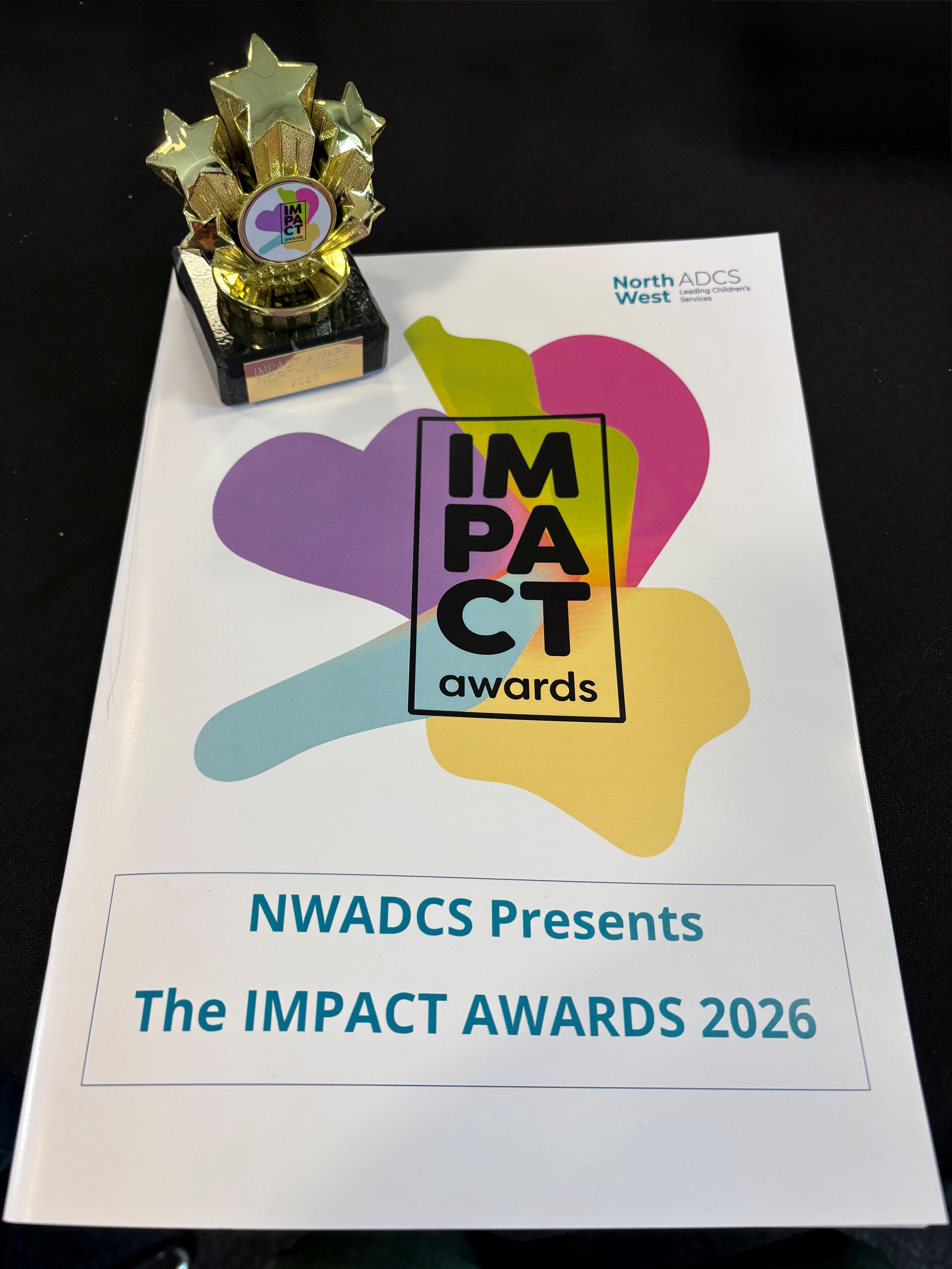 The 2026 IMPACT Awards trophy and programme