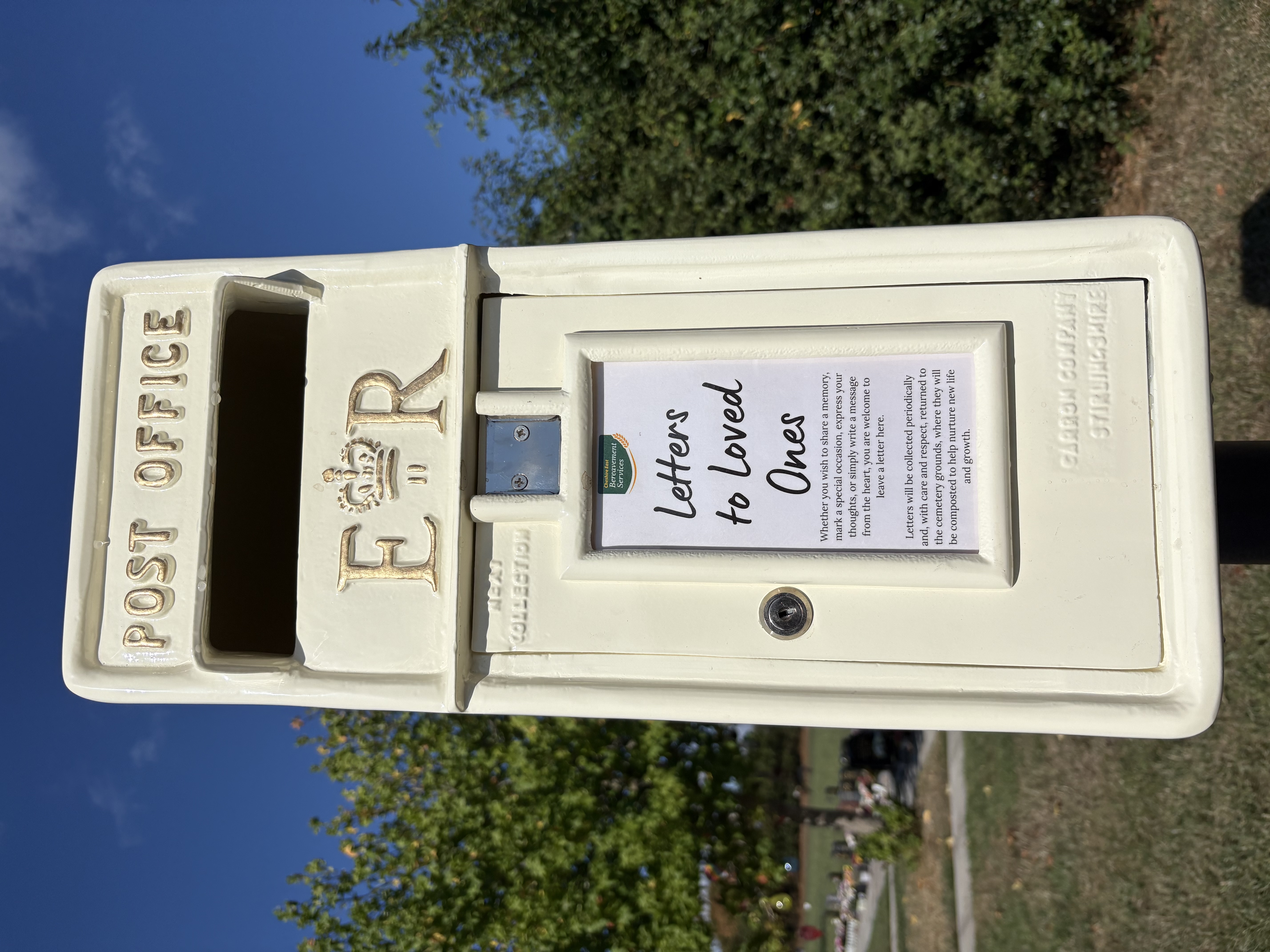 Close-up of a Letters to Loved Ones memorial post box at a Cheshire East cemetery
